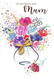 The Mother's Day card design presents a swirling watercolour bouquet that seems to glow against a crisp white background, much like a bright bunch of blooms lighting up a Kentish Town living room. At the centre, lush blossoms in purple, magenta, and rich cerise command attention, their edges defined by expressive indigo outlines that curve and weave like ink lines in a sketchbook. Softer accents of pink, rose, and airy blue filter between the bolder flowers, softening the palette and hinting at depth, as if some petals sit slightly behind others. Here and there, delicate touches of gold glint along petal tips and leaf edges, catching imaginary light the way fresh dew might on an early spring morning walk through nearby Cantelowes Gardens. The flowers gather into a rounded vase that rests at the base of the design; its shape is simple and unfussy, adorned only with an elegant golden bow that evokes the gentle crinkle of ribbon as it is tied. Around the bouquet, flecks and droplets of colour scatter outward, like petals tossed into the air or paint splashes left from a joyful creative session. Small heart motifs nestle among these specks, suggesting affection that extends beyond the confines of the arrangement. The overall mood is festive yet tender, perfectly aligned with the emotions of Mother's Day: gratitude, love, and quiet appreciation. It feels as though someone in Kentish Town has taken the time to transform their feelings into colour and movement, offering a bouquet that lives forever on paper.